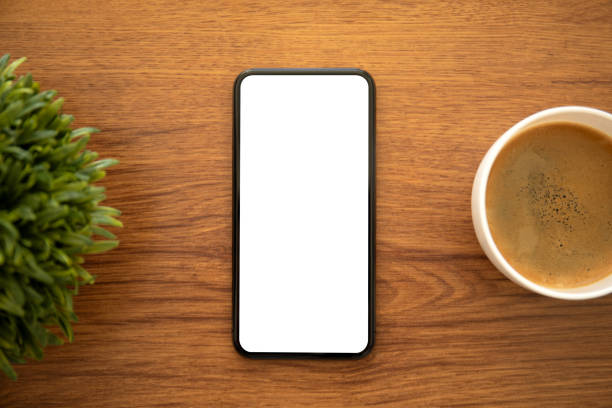istock phone with isolated screen on a table in office 1298088983
