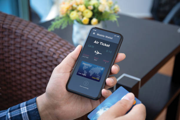 istock male hands holds phone with airplane ticket application airlines screen 1298089183