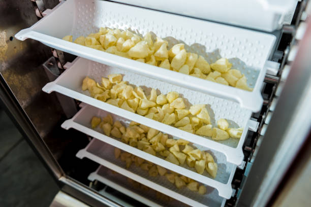 istock Conveyor line for packing snacks and chips in a modern factory 1298090362