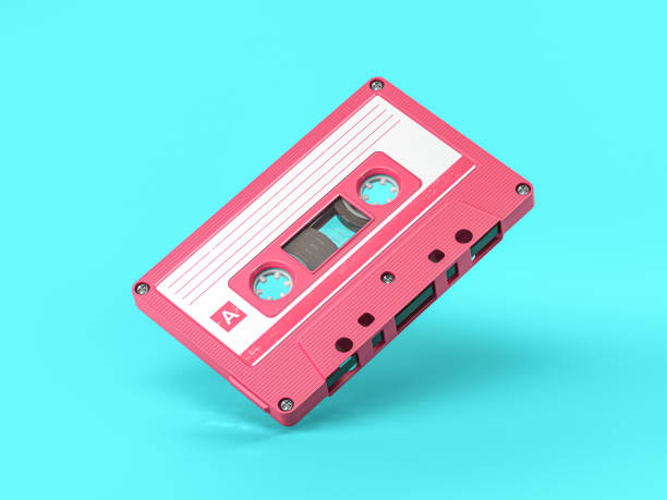 istock Pink vintage audio cassette on blue background. 1298091304