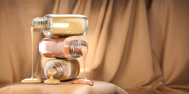 Make up liquid foundation cream cosmetics bottles ion beige velvet  background.