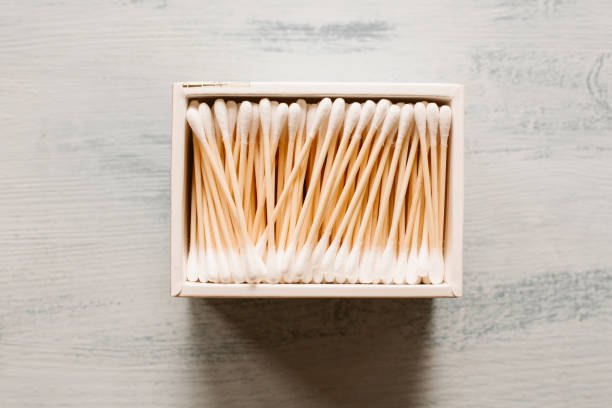 Cotton swab on blue background background