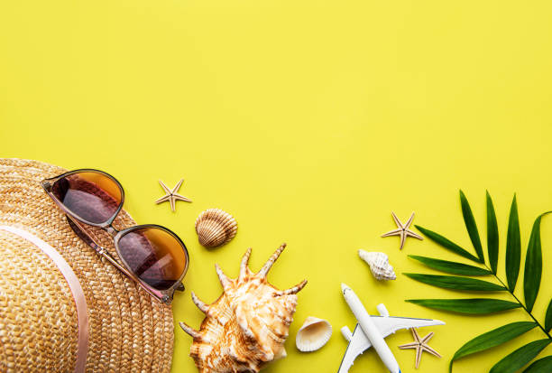istock Traveler accessories on yellow background 1298093043