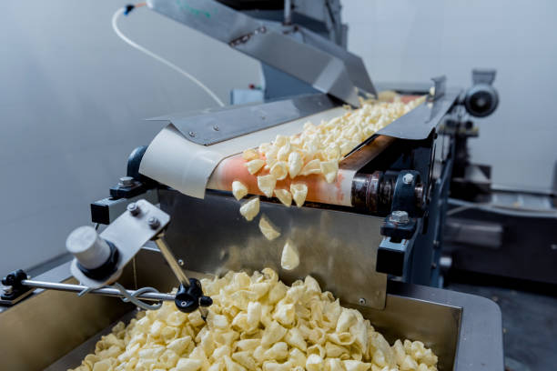 istock Conveyor line for packing snacks and chips in a modern factory 1298093845