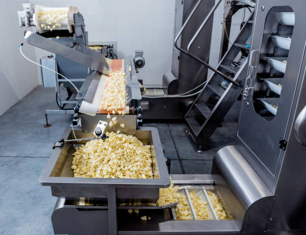 istock Conveyor line for packing snacks and chips in a modern factory 1298096703