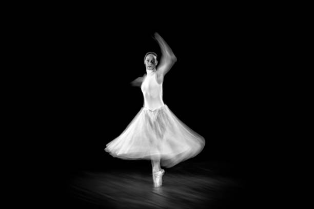 istock Dancing ballerina on a black background 1298097575