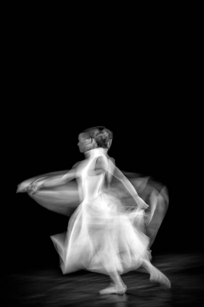 istock Dancing ballerina on a black background 1298097654