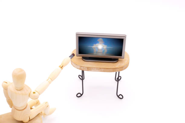 istock A drawing doll that turns off the TV with a remote control 1298099138