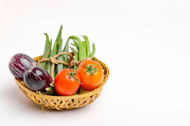 mix raw vegetable in wooden bowl on white background