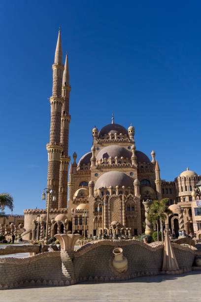 istock Beautiful large Islamic mosque at the sky background 1298100651