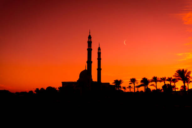 istock Beautiful large Islamic mosque at the sunset sky background 1298102272