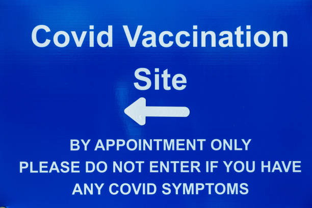 istock Sign outside Covid-19 vaccination centre 1298102360