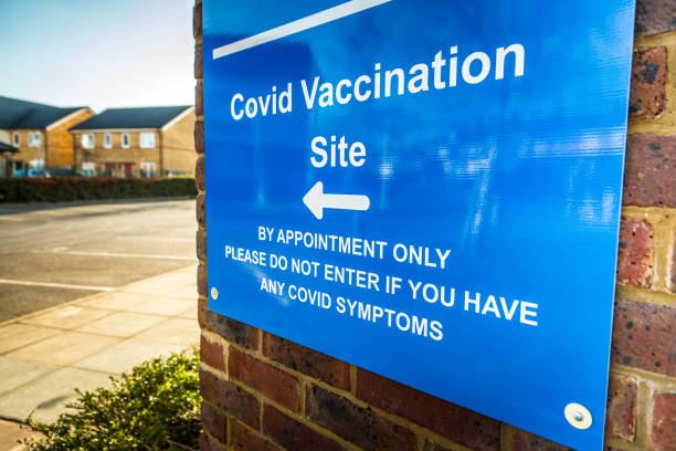 istock Sign outside Covid-19 vaccination centre 1298102364