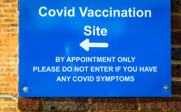 istock Sign outside Covid-19 vaccination centre 1298102369