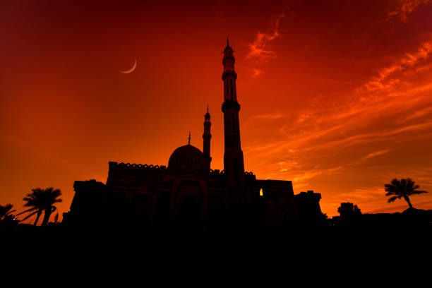 istock Beautiful large Islamic mosque at the sunset sky background 1298102437