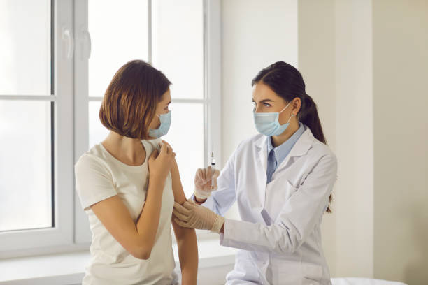 istock Vaccination in clinic office and medicare concept 1298103450