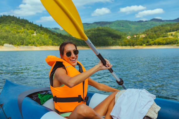 istock Female out on the water, riding kayak 1298104891