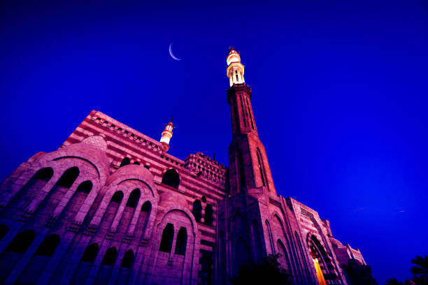 istock Beautiful large Islamic mosque at the sunset sky background 1298105032