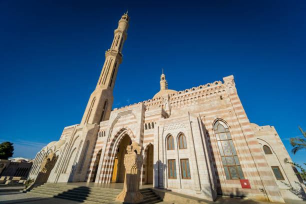 istock Beautiful large Islamic mosque at the sky background 1298105296