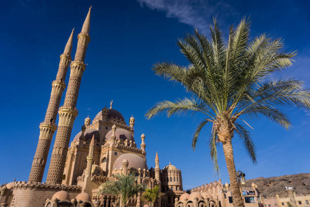 istock Beautiful large Islamic mosque at the sky background 1298105420