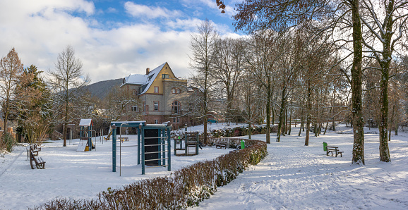 Winter scene with snow in a public park in southern Germany