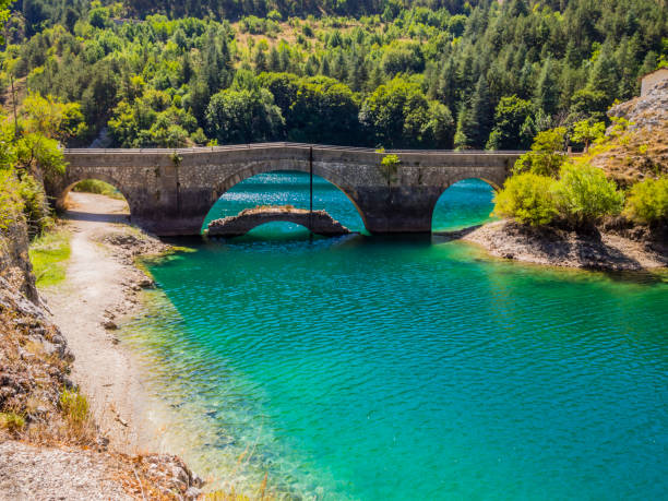 Stunning view of lake San Domenico and its famous bridge nestled in Sagittarius gorges, Villalago, Abruzzo national Park, central Italy stock photo