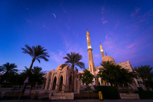 istock Beautiful large Islamic mosque at the sunset sky background 1298107977