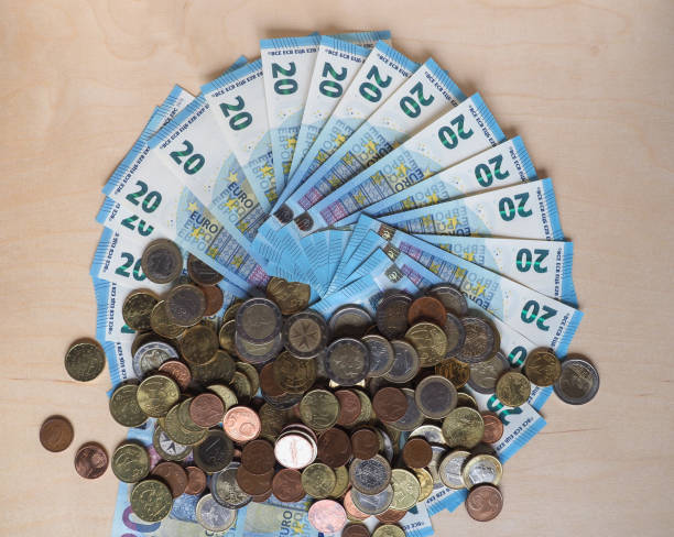 istock Euro notes and coins, European Union 1298108230