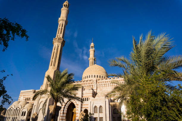 istock Beautiful large Islamic mosque at the sky background 1298108289