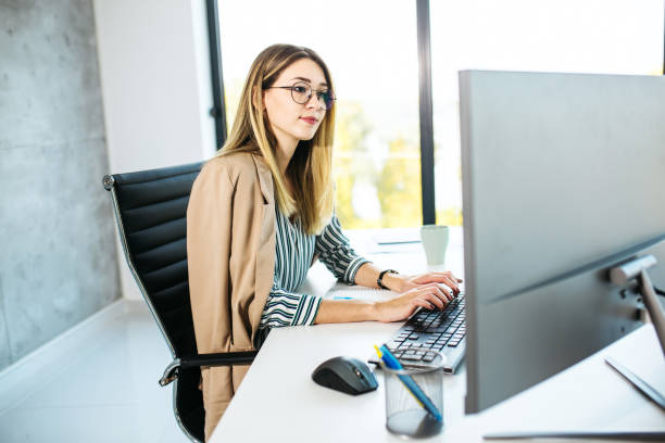 istock Beautiful female working from home 1298108361