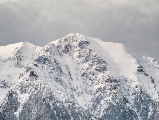 istock Winter landscape with mountain peaks covered in snow. Beautiful view with Bucegi Mountains part of the Carpathian Mountains, in Romania. 1298109267