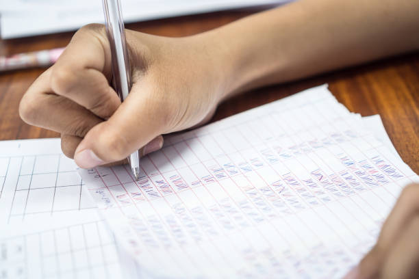 istock Teacher or researchers checking statistical in document paper on questionnaires about education and teaching. As well as satisfaction of students in learning 1298109694