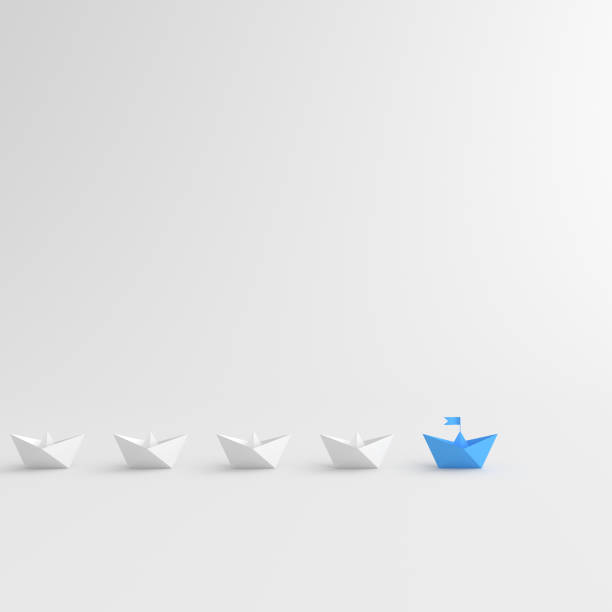 istock Leadership concept, blue leader boat leading whites 1298110734