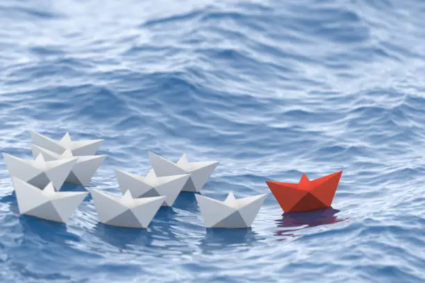 Leadership concept, red leader boat leading whites. 3D Rendering