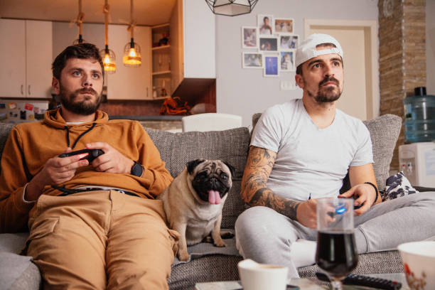 istock Excited friends playing video games 1298110817