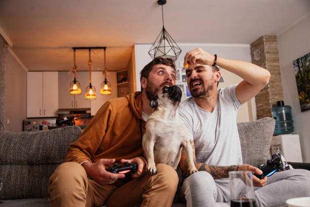istock Excited friends playing video games 1298110902