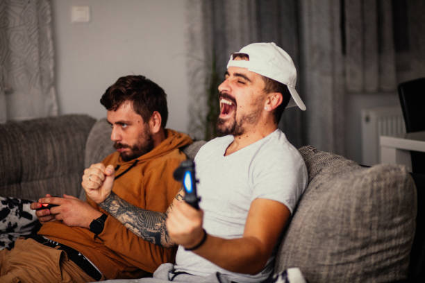 istock Excited friends playing video games 1298110977