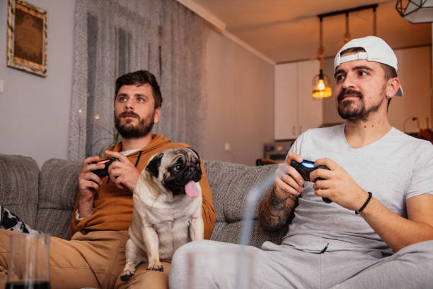 istock Excited friends playing video games 1298111535