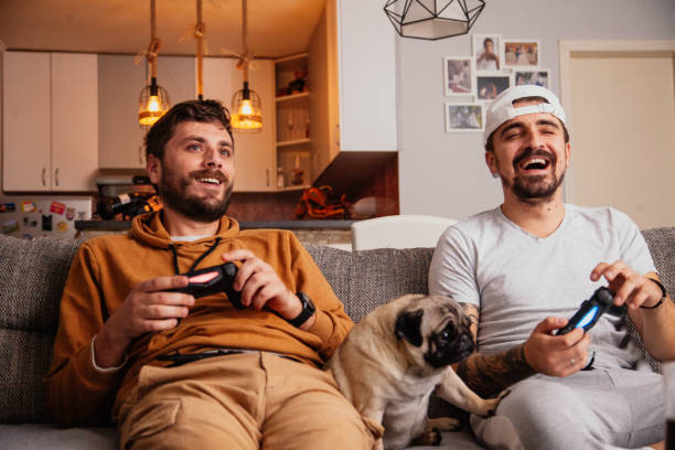 istock Excited friends playing video games 1298111576