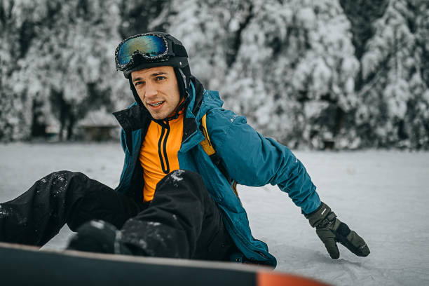 istock Snowboarder sitting and enjoying the mountain view 1298114517
