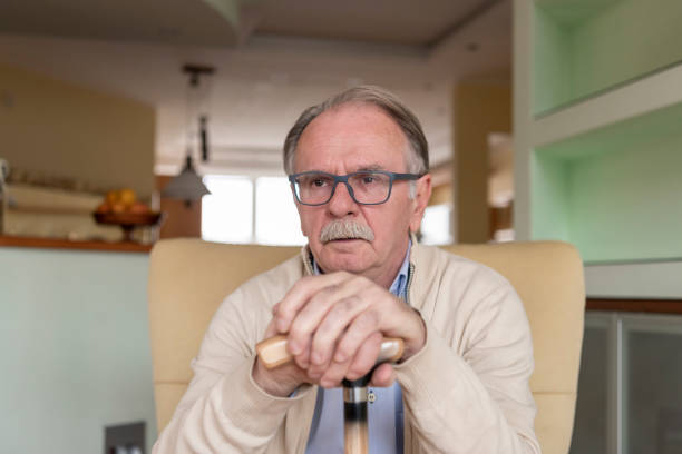istock Senior Man is Sitting at Home in Deep Thoughts. 1298114832