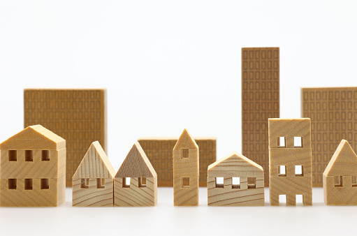 Miniature models of buildings on white background