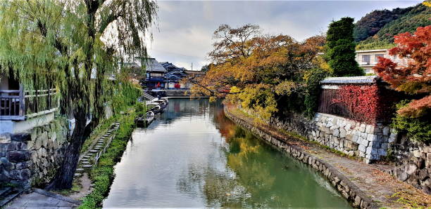 istock Small River in Little Japanese Town. Autumn Time. 1298119433