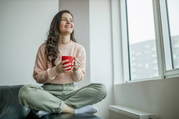 istock Woman enjoying in coffee at home 1298119728