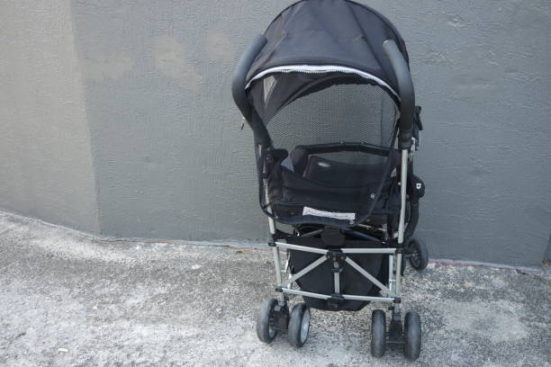 istock Black color baby stroller with head covering 1298121550