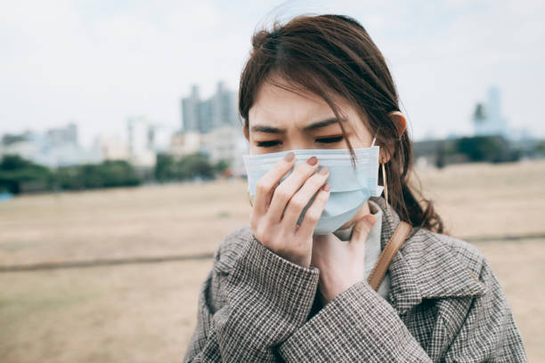 istock Woman Feeling Sick And Wearing Face Mask 1298123431