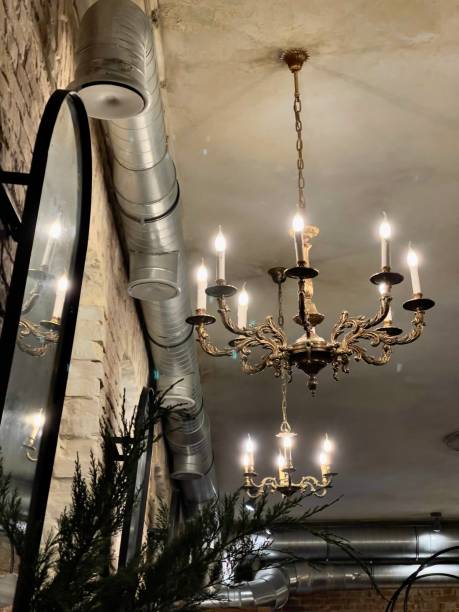 istock ceiling with antique chandeliers and ventilation pipe 1298123504