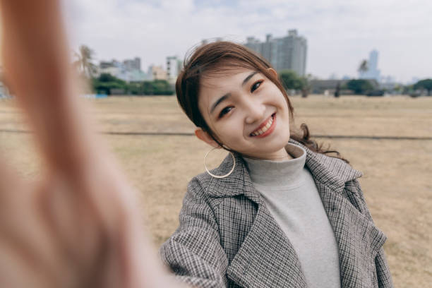 istock Asian woman smile take selfie 1298124689