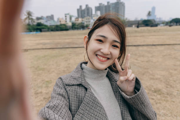istock Asian woman smile take selfie 1298124738