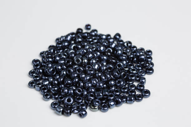 istock heap of black glass beads 1298125004